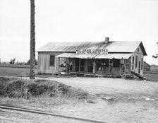 Plantation store, Mississippi Delta, 1936. Creator: Dorothea Lange