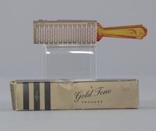 Plastic brush with box from Mae's Millinery Shop, 1941-1994. Creator: Gold Tone