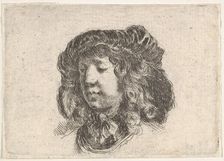 Plate 34: head of a young man in a cap adorned with a few feathers, turned three-quart..., ca. 1646. Creator: Stefano della Bella