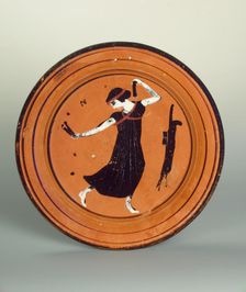Plate with a dancing girl. Attic pottery