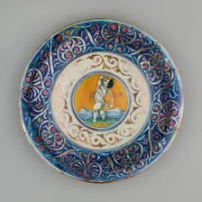 Plate with Cupid, Gubbio, 1530/40. Creators: Unknown, Giorgio Andreoli workshop