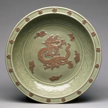 Plate with Relief Dragon among Clouds, 1300s. Creator: Unknown