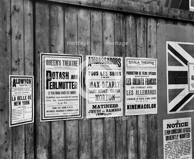 Playbills on a hoarding, London, October 1914. Artist: Adolph Augustus Boucher.