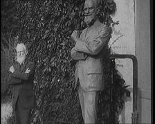 Playwright George Bernard Shaw Standing Next To a Statue of Himself, 1920s. Creator: British Pathe Ltd