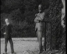 Playwright George Bernard Shaw Standing Next To a Statue of Himself, 1920s. Creator: British Pathe Ltd