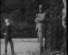 Playwright George Bernard Shaw Standing Next To a Statue of Himself, 1920s. Creator: British Pathe Ltd