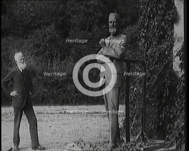 Playwright George Bernard Shaw Standing Next To a Statue of Himself, 1920s. Creator: British Pathe Ltd.