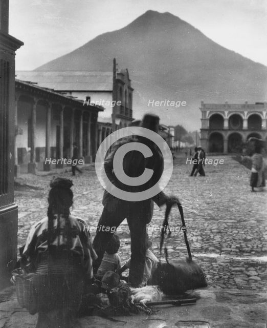 Plaza and volcano of Antigua, Guatemala, between 1899 and 1926. Creator: Arnold Genthe.
