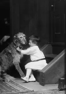 Plottner boy with dog, portrait photograph, 1907 Oct. 16. Creator: Arnold Genthe