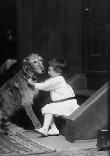 Plottner boy with dog, portrait photograph, 1907 Oct. 16. Creator: Arnold Genthe