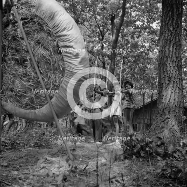 Practicing on the archery range at Camp Fern Rock, Bear Mountain, New York, 1943 Creator: Gordon Parks.