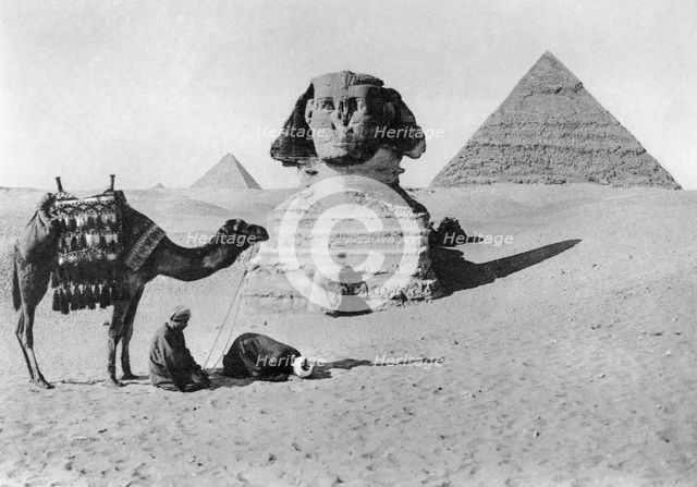Praying before a sphinx, Cairo, Egypt, c1920s. Artist: Unknown