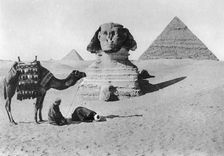 Praying before a sphinx, Cairo, Egypt, c1920s