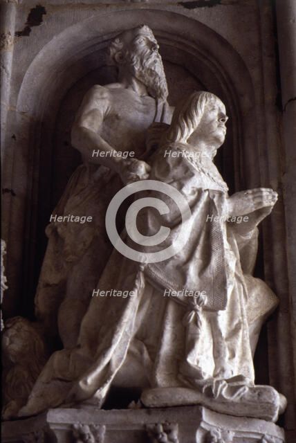 Praying statue of Don Manuel in the façade of the Jeronimos Monastery in Lisbon.