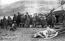 Preobrazhenie Bay: Chukchi in front of their home, in national traditional fur clothing..., 1910-29. Creator: Ivan Emelianovich Larin