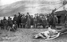 Preobrazhenie Bay: Chukchi in front of their home, in national traditional fur clothing..., 1910-29. Creator: Ivan Emelianovich Larin