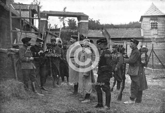 ''Premiers Prisonniers Allemands; Ensuite, on les interroge', 1914. Creator: Unknown.