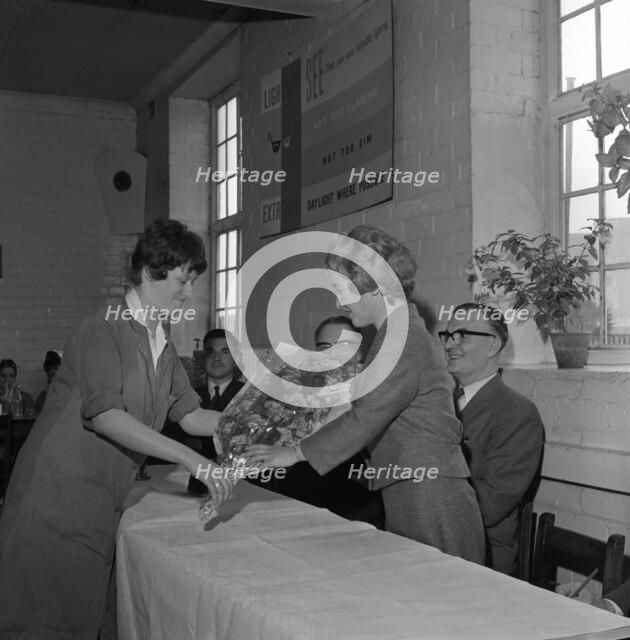 Presentation to a female worker at the ICI Detonator works, Denaby Main, South Yorkshire, 1962.  Artist: Michael Walters