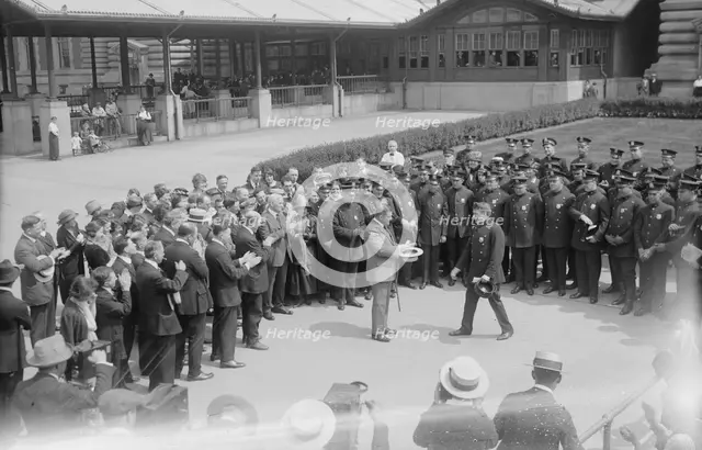 Presenting pen to Wallis, between c1915 and c1920. Creator: Bain News Service.