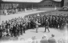 Presenting pen to Wallis, between c1915 and c1920. Creator: Bain News Service