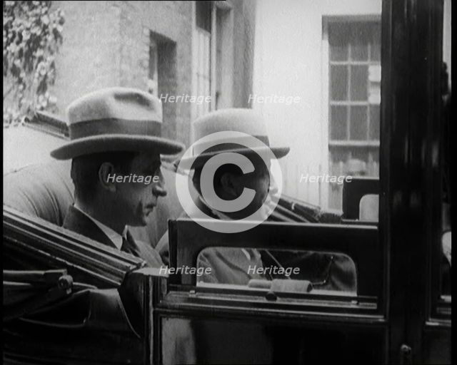 President of the Irish Republic Eamon De Valera Getting Into a Motorcar With a British Man..., 1921. Creator: British Pathe Ltd.
