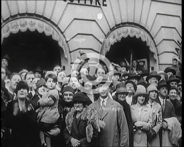 Press and Members of Public Watching Charles Lindbergh and Anne Morrow Lindbergh Waving..., 1920s. Creator: British Pathe Ltd.