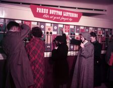 Press Button Listening HMV, Oxford Street, London, 1953. Creator: Arthur Charles Kirby Ware