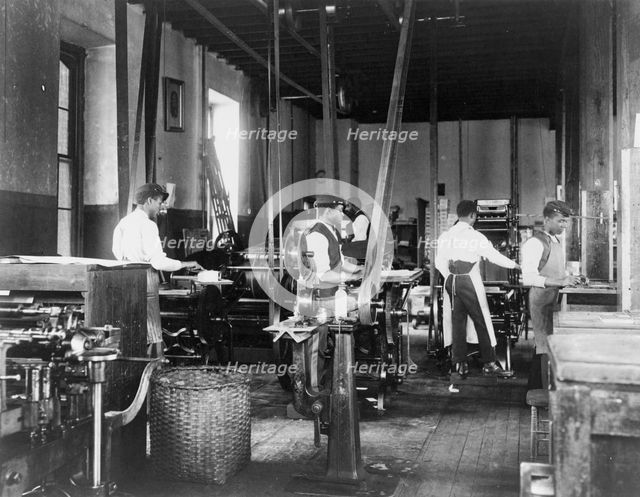 Pressmen at work in printing shop, Hampton Institute, Hampton, Virginia, 1899 or1900. Creator: Frances Benjamin Johnston.