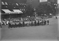 Preparedness Parade - Men Carrying Huge Flag, 1916. Creator: Harris & Ewing