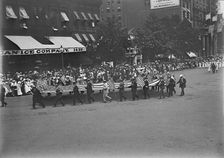 Preparedness Parade - Men Carrying Huge Flag, 1916. Creator: Harris & Ewing