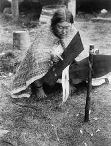 Preparing cedar bark-Nakoaktok, c1914. Creator: Edward Sheriff Curtis