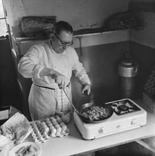 Preparing food for staff working on the construction site of the M1, 09/1958. Creator: John Laing plc