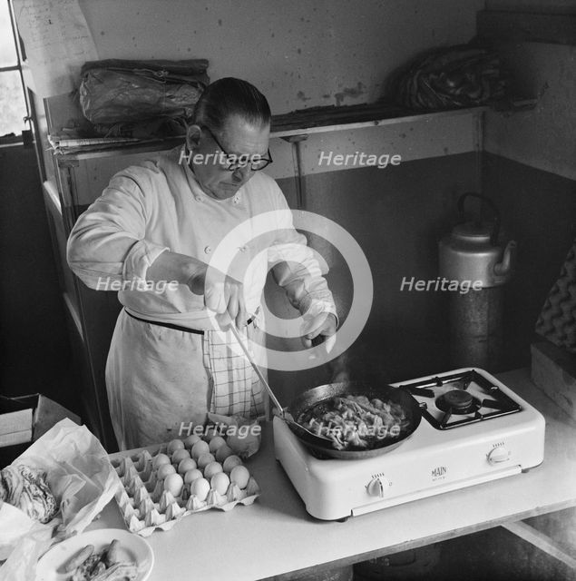 Preparing food for staff working on the construction site of the M1, 09/1958. Creator: John Laing plc.