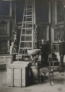 Preparing paintings for evacuation from one of the Italian halls at the Hermitage, 1917