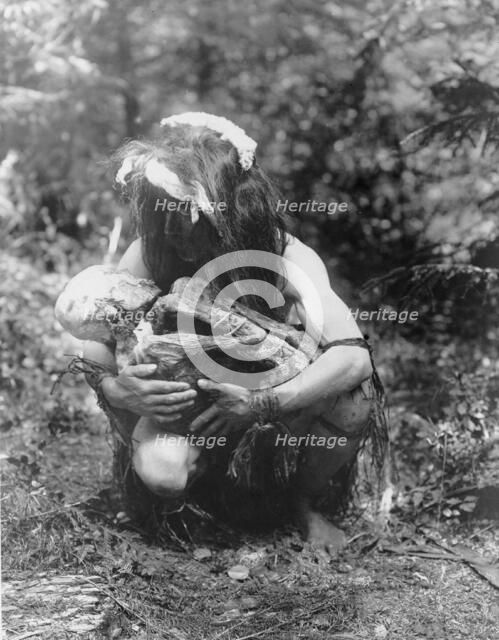 Preparing to eat the mummy, c1911. Creator: Edward Sheriff Curtis.