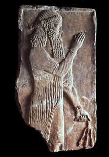 Priest with a branch of pomergranate tree 722-705 BC
