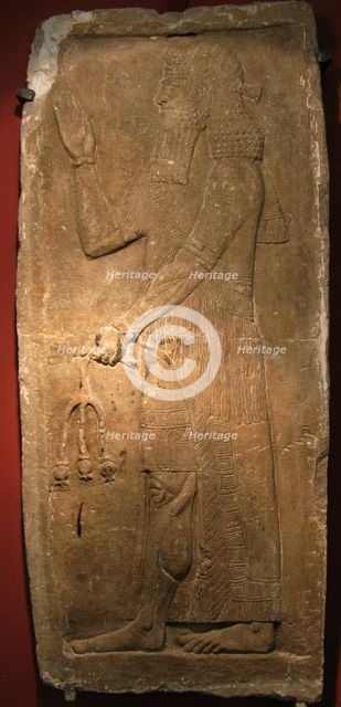 Priest with a branch of pomergranate tree. Detail of a relief from the palace of Assyrian king Sargon II, 722-705 BC. Artist: Assyrian Art  