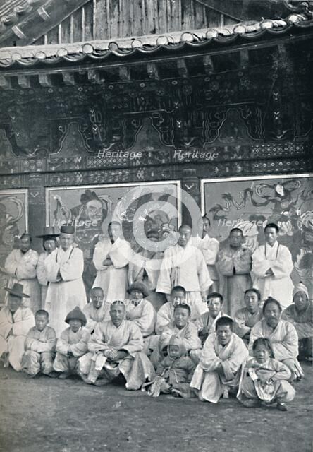Priests and monks in a Korean monastery, or lamasery, 1902. Artist: Walter Hillier.