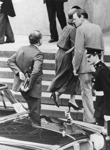 Prime Minister Margaret Thatcher's detective follows her out of her car, London, 16th July 1980