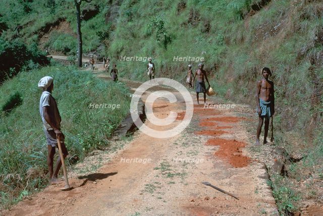 Primitive road-repairs in Sri Lanka. Artist: CM Dixon Artist: Unknown