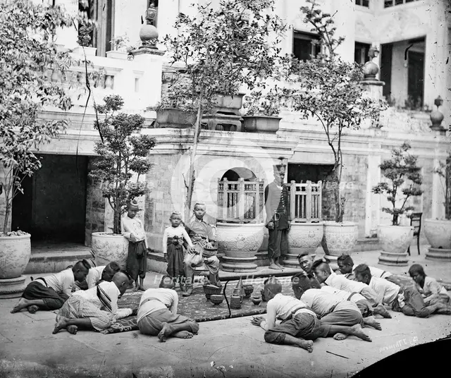 Prince Chulalongkorn of Siam [Thailand] (seated, centre), with Prince Bhanugrangsi Savan..., 1866. Creator: John Thomson.