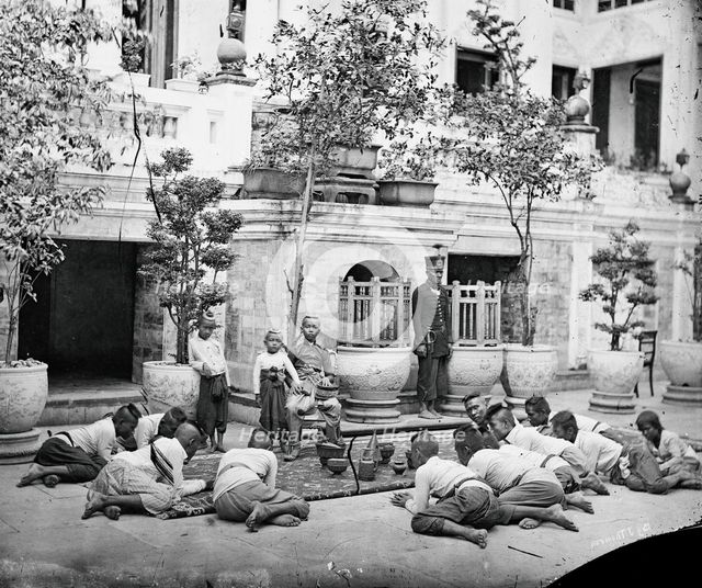 Prince Chulalongkorn of Siam [Thailand] (seated, centre), with Prince Bhanugrangsi Savan..., 1866. Creator: John Thomson.