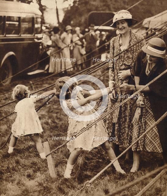 Princess Elizabeth and Princess Margaret pull their weight, 1930s (1935). Artist: Unknown.