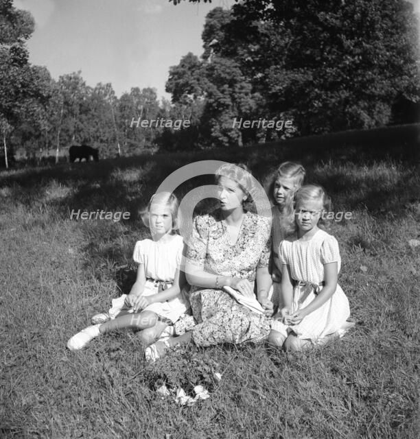 Princess Sibylla with the little princesses in Hagaparken, Stockholm, Sweden,  17/8 1944.
 Creator: Unknown.