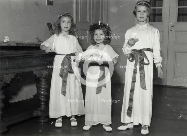 Princesses Birgitta, Desiree and Margaretha of Sweden, St Lucy's Day, 1943. Creator: Karl Sandels.