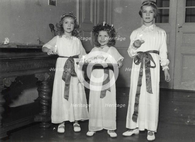 Princesses Birgitta, Desiree and Margaretha of Sweden, St Lucy's Day, 1943. Artist: Karl Sandels