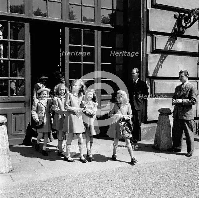 Princesses Birgitta, Margaretha and Desiree on their way from the Castle School, 24/5 1946.

 Creator: Unknown.