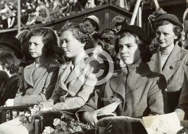 Princesses Desiree, Birgitta and Margaretha of Sweden at a dog show, Stockholm, 1950. Creator: Unknown.