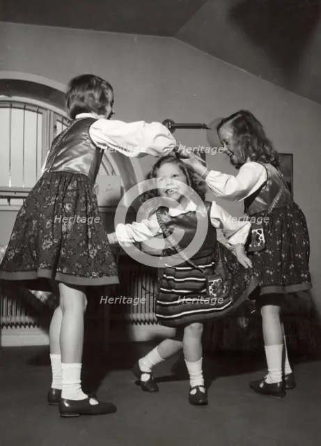 Princesses Margaretha, Desiree and Birgitta of Sweden dancing, April 1943. Creator: Karl Sandels.
