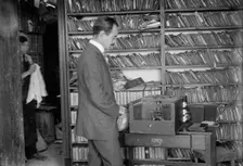 Printing the Bain News Service photos using a Bain-McDonald auto printer, between c1910 and c1915. Creator: Bain News Service